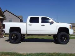 2010 Silverado Lifted 10" with 22" XD Monsters and