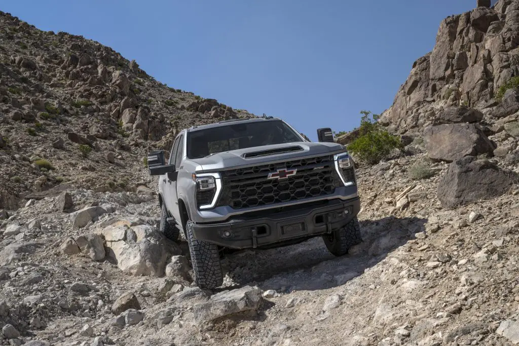 The 2024 Silverado HD ZR2 Bison rock crawling on an off-road trail