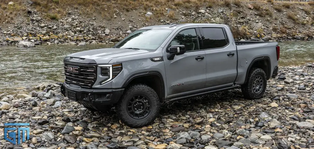 A 2024 GMC Sierra 1500 AT4X AEV Edition Pickup next to a beautiful river