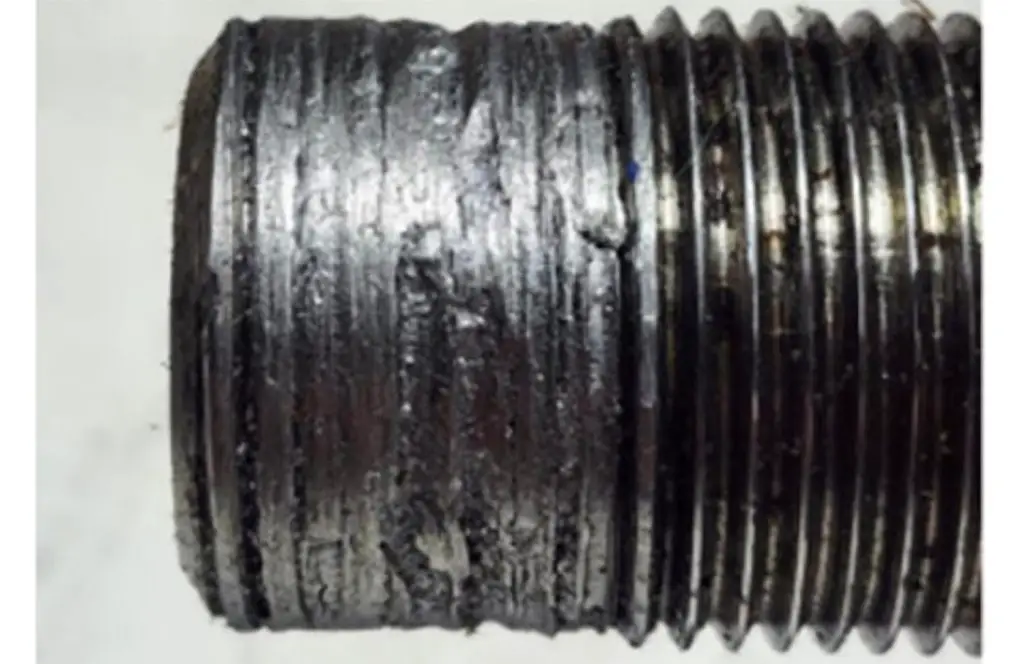 The damage caused to a wheel drive shaft nut when removed using power equipment (Image Courtesy GM-Techlink)