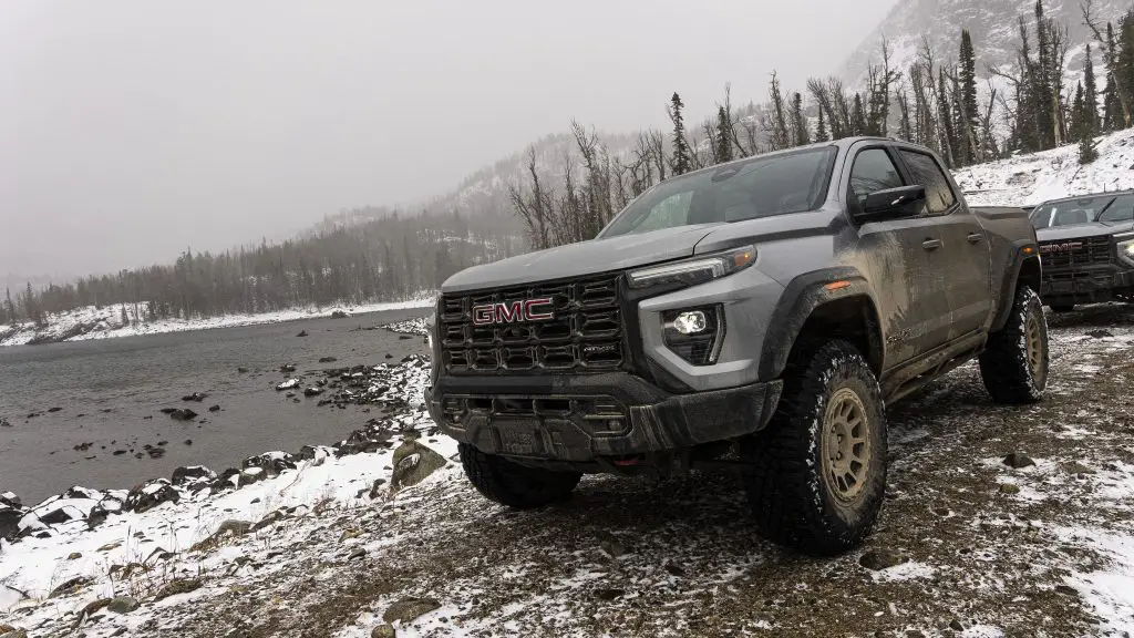 The 2023 GMC Canyon in a cold winter forest with snow