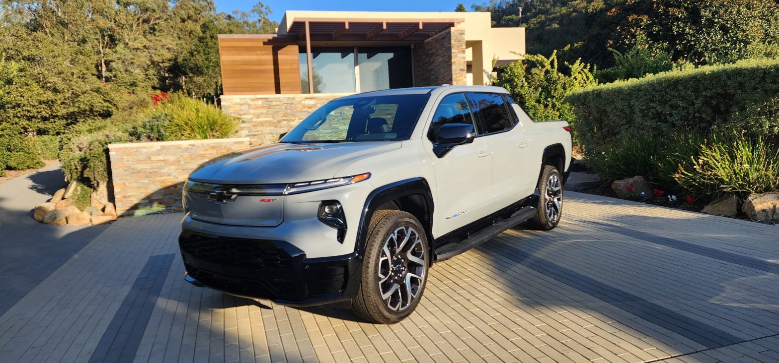 A blue grey Chevrolet Silverado EV RST parked in a driveway