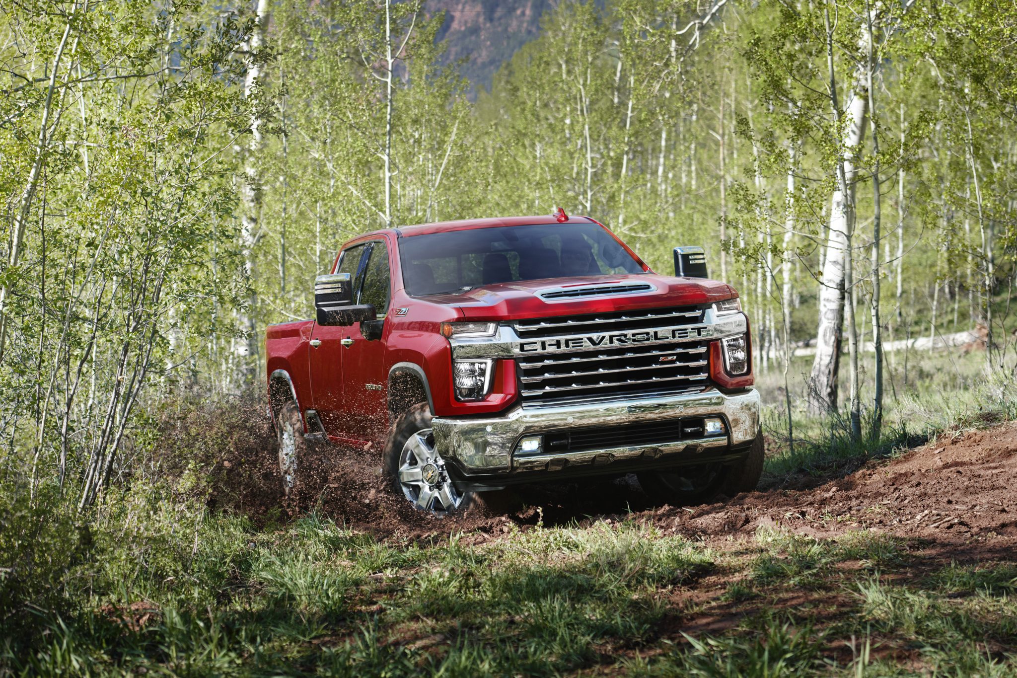 2022 Chevrolet Silverado 2500HD with Duramax Diesel Engine driving off-road in a forest